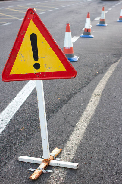 Attention sign. Road traffic limited. Triangle with red border. Bypass at the street - 写真・画像