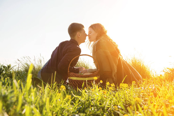 View from the back. Young married couple on picnic outdoors - Photo, Image