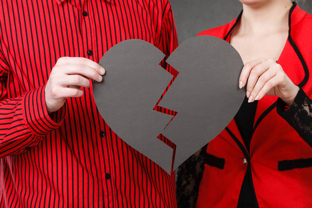 Man and woman holding broken heart - Foto, Imagen