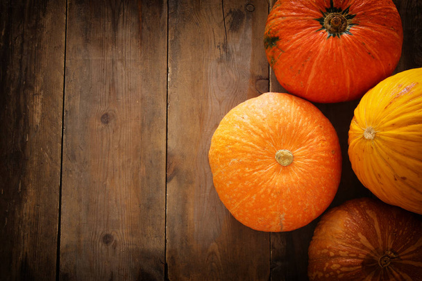 Pumpkins on wooden background. thanksgiving and halloween concept - Photo, Image