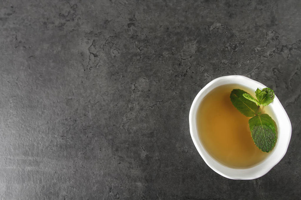 Fresh mint leaves in tea. Italian herbs. Dark background. - Fotografie, Obrázek
