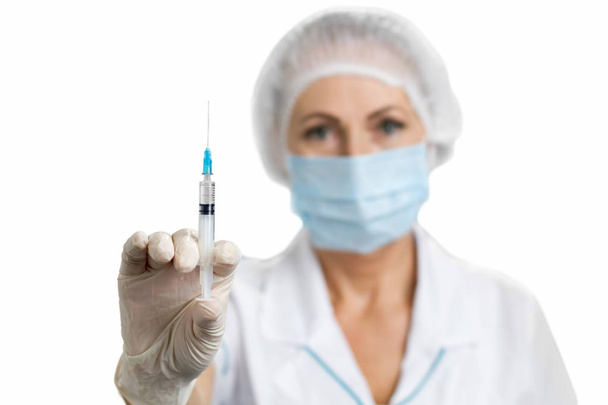 Professional nurse with injection. - Photo, image