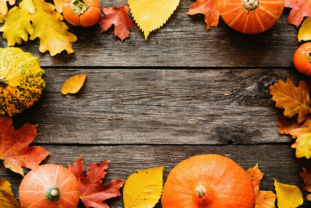 Autumn seasonal background with fallen leaves and pumpkins - Photo, Image