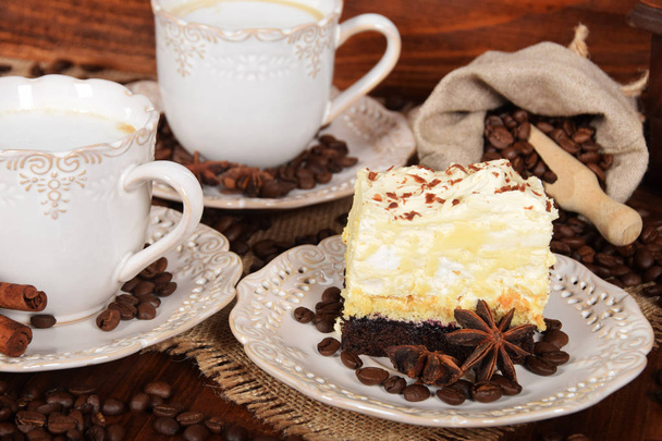 coffee cake with foam and chocolate sprinkles and delicious coff - Φωτογραφία, εικόνα