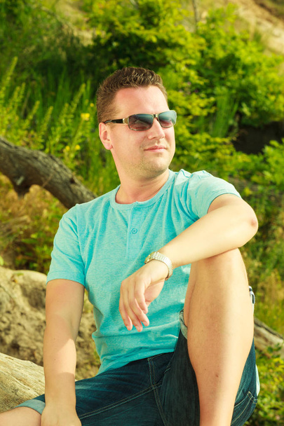Handsome man relaxing on beach during summer. - Fotoğraf, Görsel