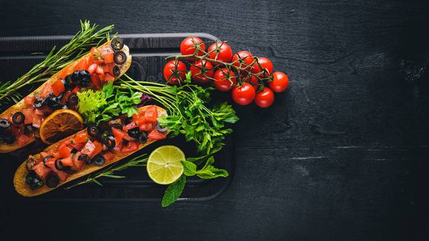 Bruschetta with tomatoes, olives - Фото, изображение