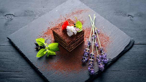 Chocolate cake with fresh berries. On a wooden background. Top review. Free space. - Foto, immagini