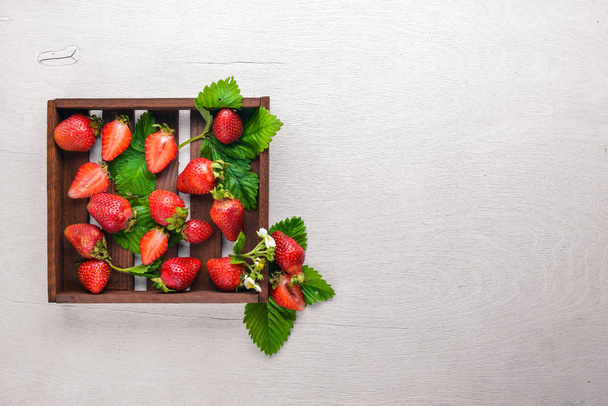 Fresh strawberries. Healthy food. On Wooden background. Top view. Free space. - Valokuva, kuva