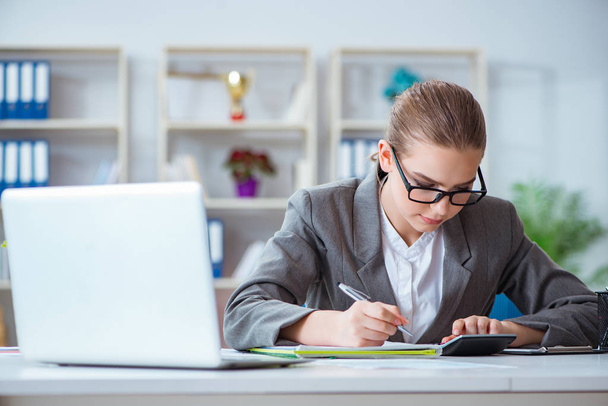 Young businesswoman accountant working in the office - Photo, Image
