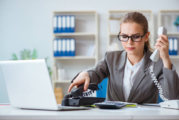 Young businesswoman accountant working in the office - 写真・画像