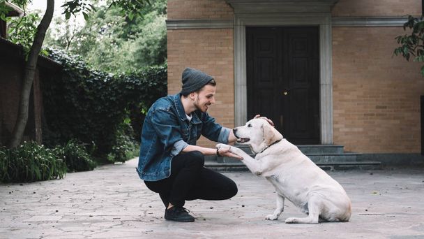 A guy with a dog - Foto, Imagem