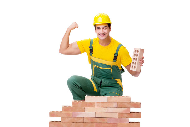 The handsome construction worker building brick wall - Photo, Image
