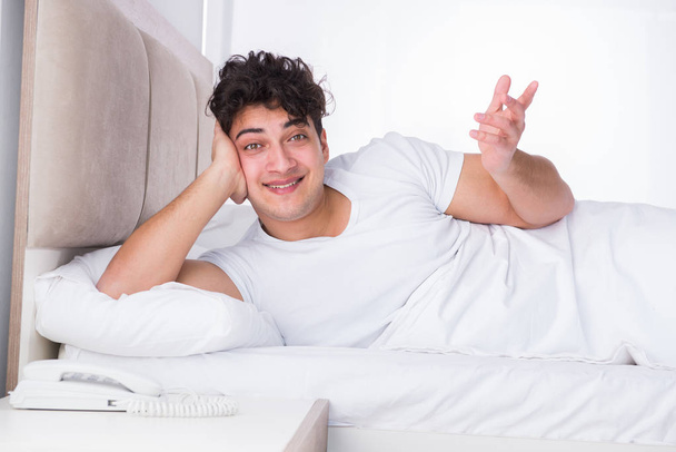 Man in bed suffering from insomnia - Fotografie, Obrázek