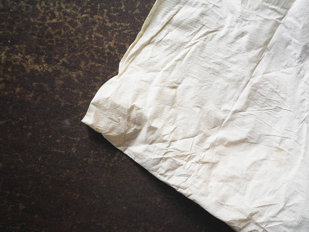 Pile of paper napkins on wooden background - Zdjęcie, obraz
