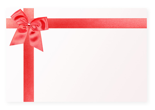 Red holiday bow on white card - Фото, изображение