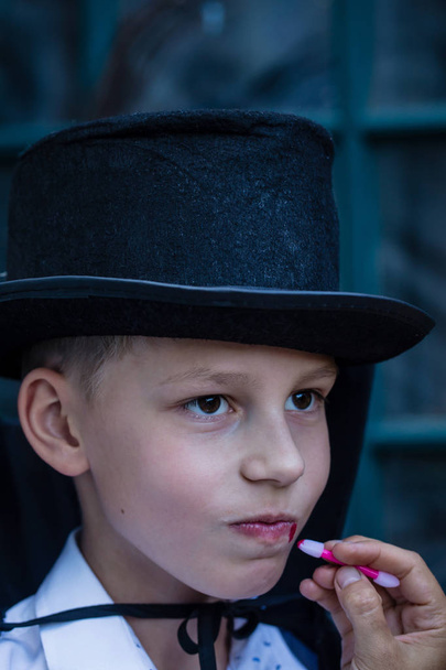 The boy is dressed as a vampire - Фото, изображение
