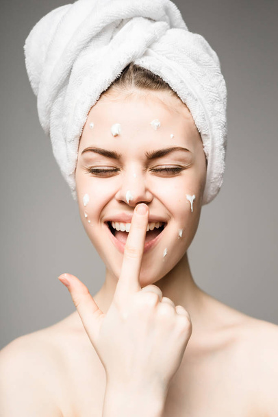 Beauty skin care, woman applying cream on face,fun teen - Фото, зображення