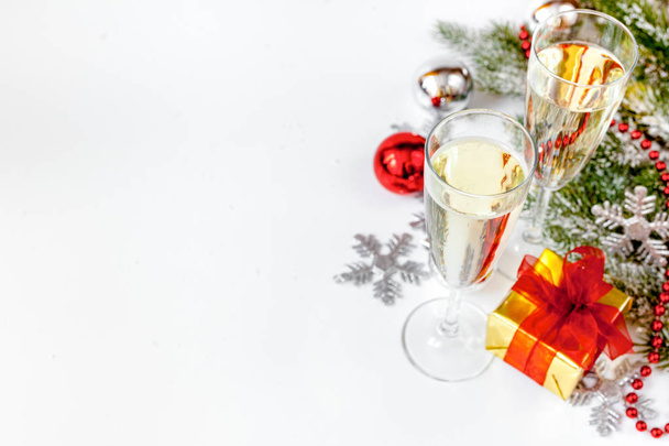glasses of champagne and Christmas ornaments top view - Фото, изображение