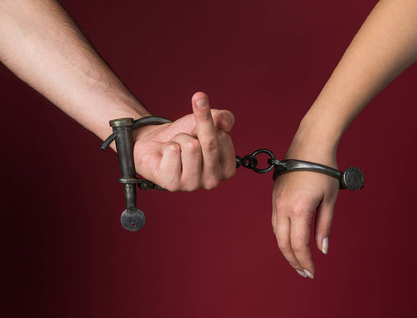 male and female hands are handcuffed. - Zdjęcie, obraz