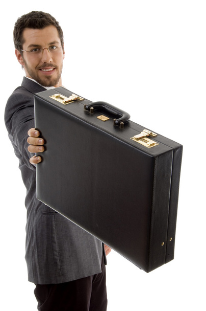 Young executive showing his briefcase - Fotó, kép