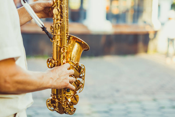 saxophonist plays on the street - Photo, Image