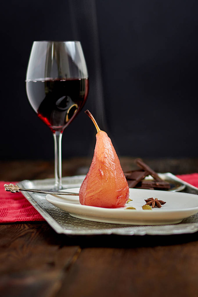 hot pear cooked in red wine with spices - 写真・画像