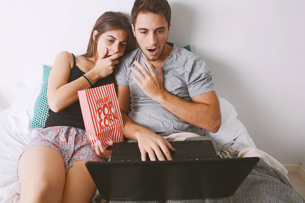 Couple watching movies in bed. - Foto, Imagem
