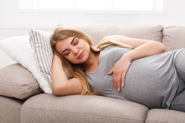 Pensive pregnant woman dreaming about child - Фото, изображение