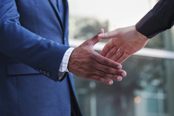 Businessman giving hand for handshake - Fotó, kép