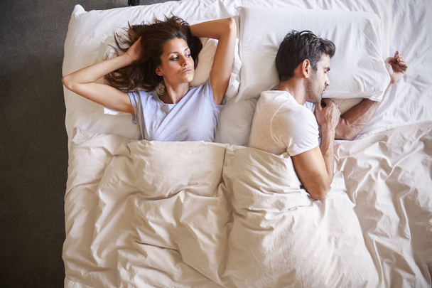 Couple lying in bed together - Photo, image