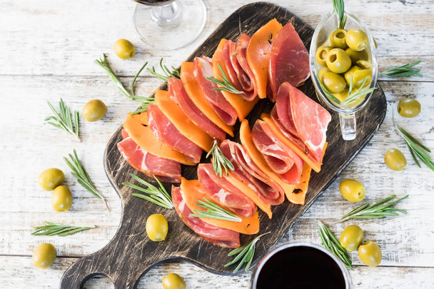 Marble ham and cheese with pumpkin seeds on a rustic board - Photo, Image