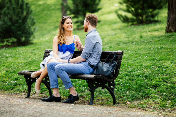 Couple in love on park bench - Zdjęcie, obraz