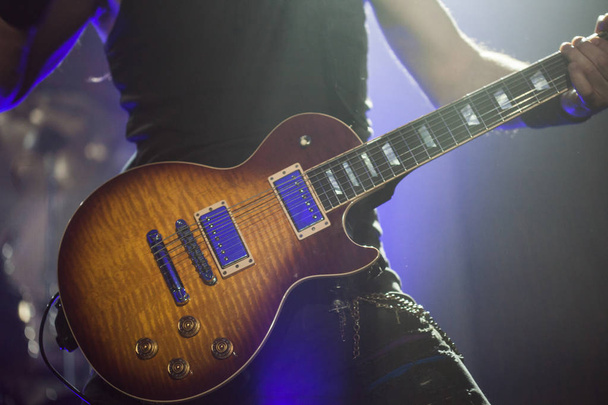 Guitarist on stage, guitar closeup - Foto, afbeelding