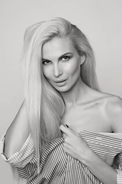 Sexy blonde woman in striped shirt, monochrome shot - Фото, зображення