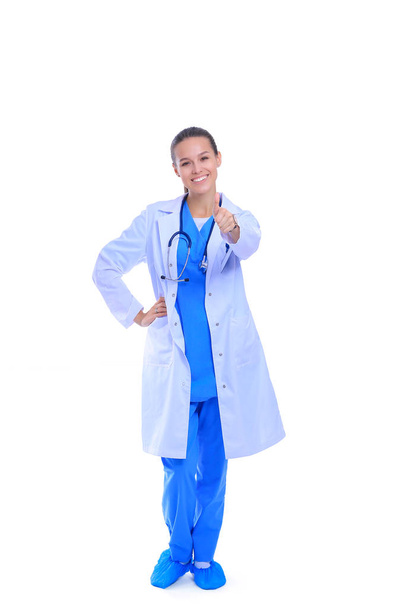Beautiful young woman in white coat posing with hand in pocket. Woman doctor - Foto, Imagem