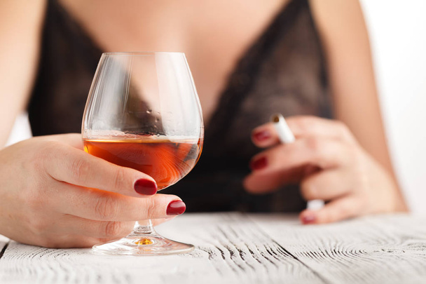 Drunk woman in lace underwear with glass of whiskey - Photo, Image