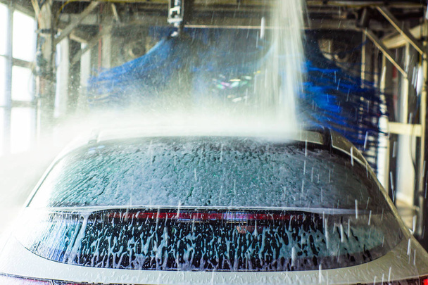 c Automatic car wash in action - 写真・画像