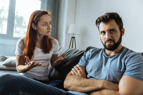 Depressed unhappy woman looking at her boyfriend - Photo, Image