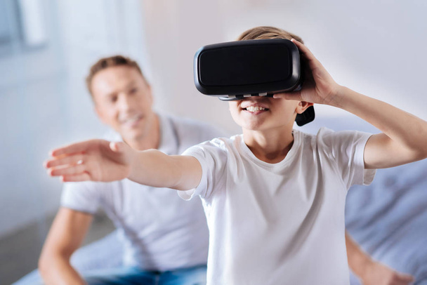 Happy little boy wearing a VR headset - Φωτογραφία, εικόνα
