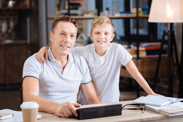 Happy father and son posing in fathers study - Photo, Image