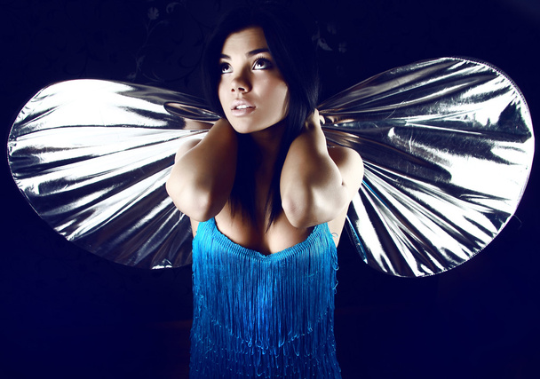Bellezza con ali argentee di falena
 - Foto, immagini