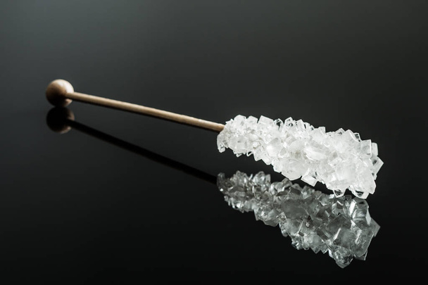 Crystallized sugar on wooden stick. - Fotoğraf, Görsel