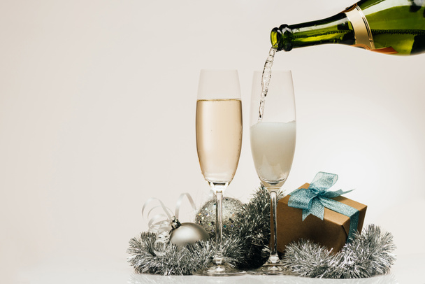 pouring champagne into wineglass - Foto, Bild