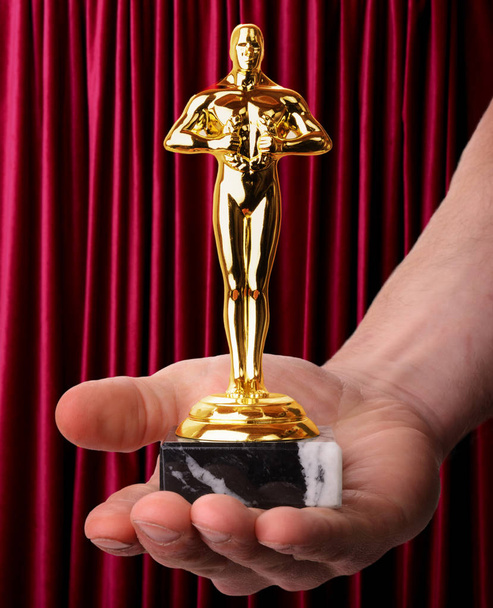 Awards trophy on red background - Photo, Image