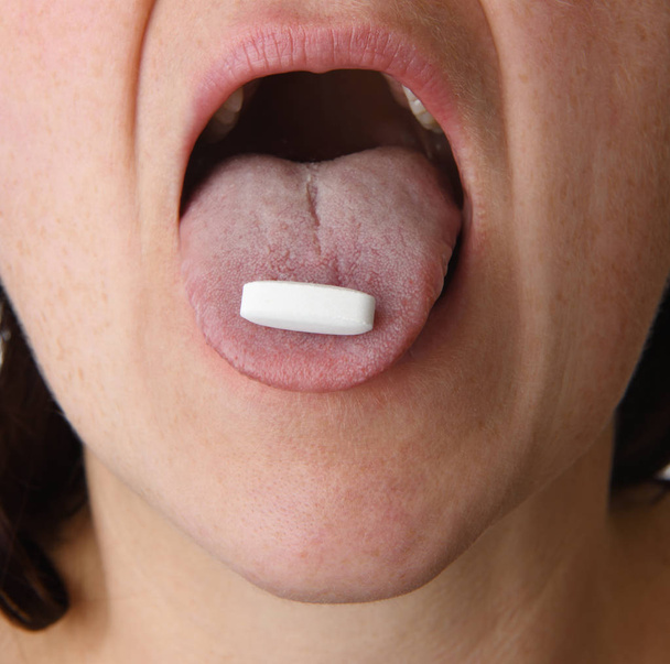 woman taking pill - Photo, Image