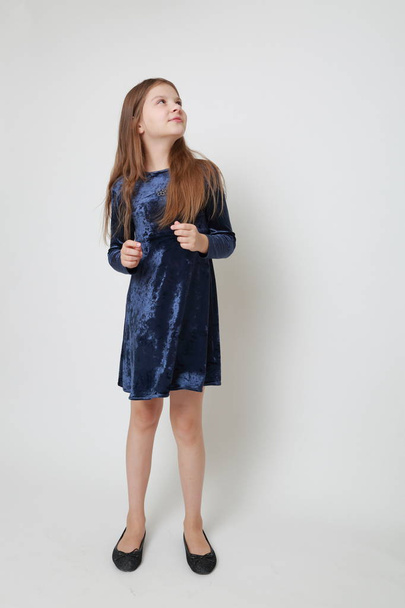 Gorgeous teen girl in a dress posing for a studio portrait - Φωτογραφία, εικόνα