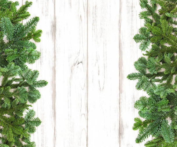 Christmas tree branches decoration wooden background - Фото, изображение