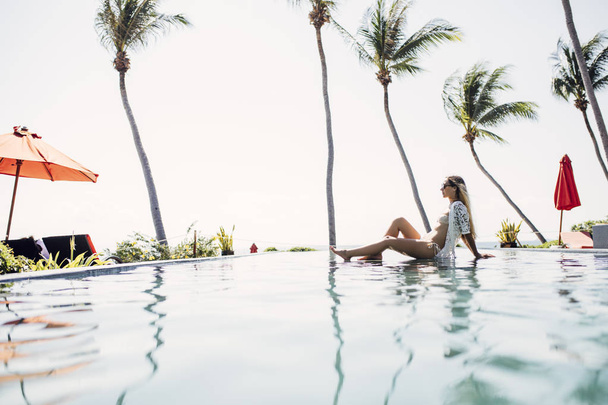 Woman Enjoying Summertime at Exotic Resort - Фото, изображение