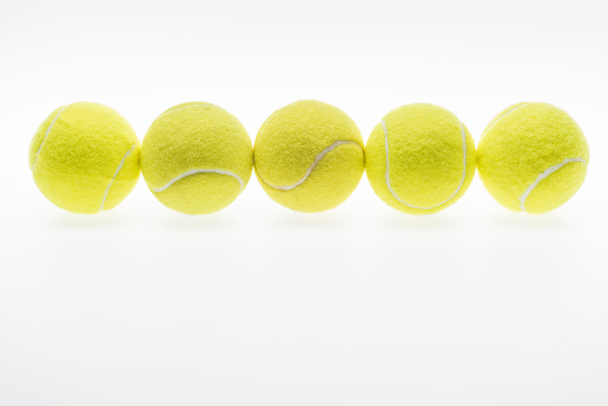 tennis balls in row - Фото, изображение