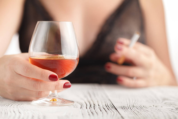 woman drinking alcohol on white background. Focus on wine glass - Photo, Image